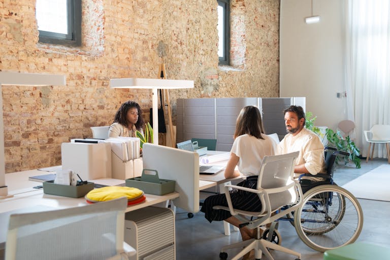 Diverse team of professionals working together in a&nbsp;stylish modern office.